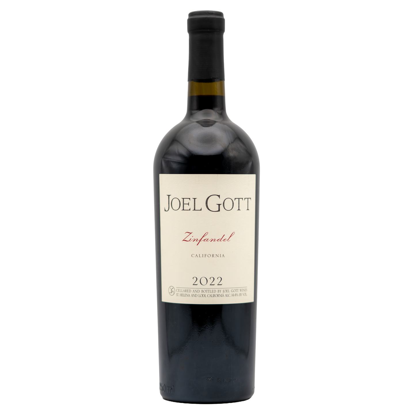 Bottle of Joel Gott Zinfandel red wine from Berkman Cellars with label and cork on a dark surface.