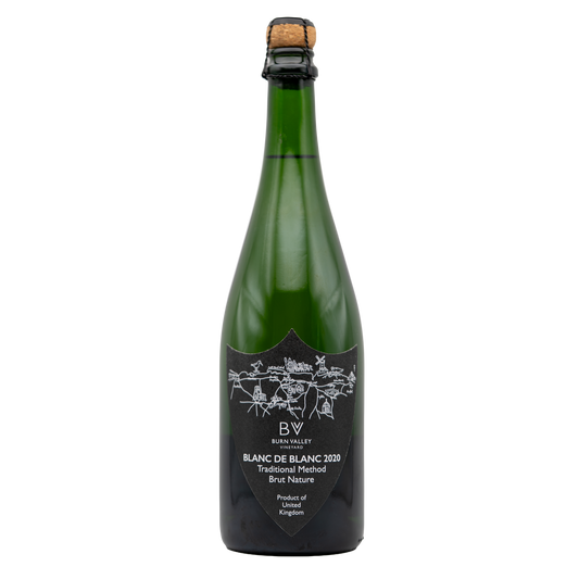 Bottle of Burn Valley Vineyard Blanc de Blanc sparkling wine with a clear label and foil top, set against a neutral background.