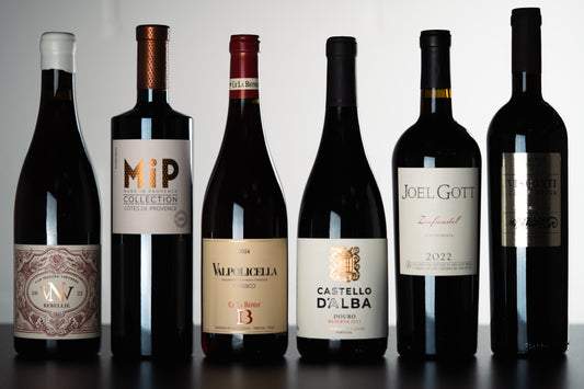 Six bottles of Caught Red Handed wine bundle by WINESLUT, showcasing red wine bottles with labels and corks in a wine bundle set.