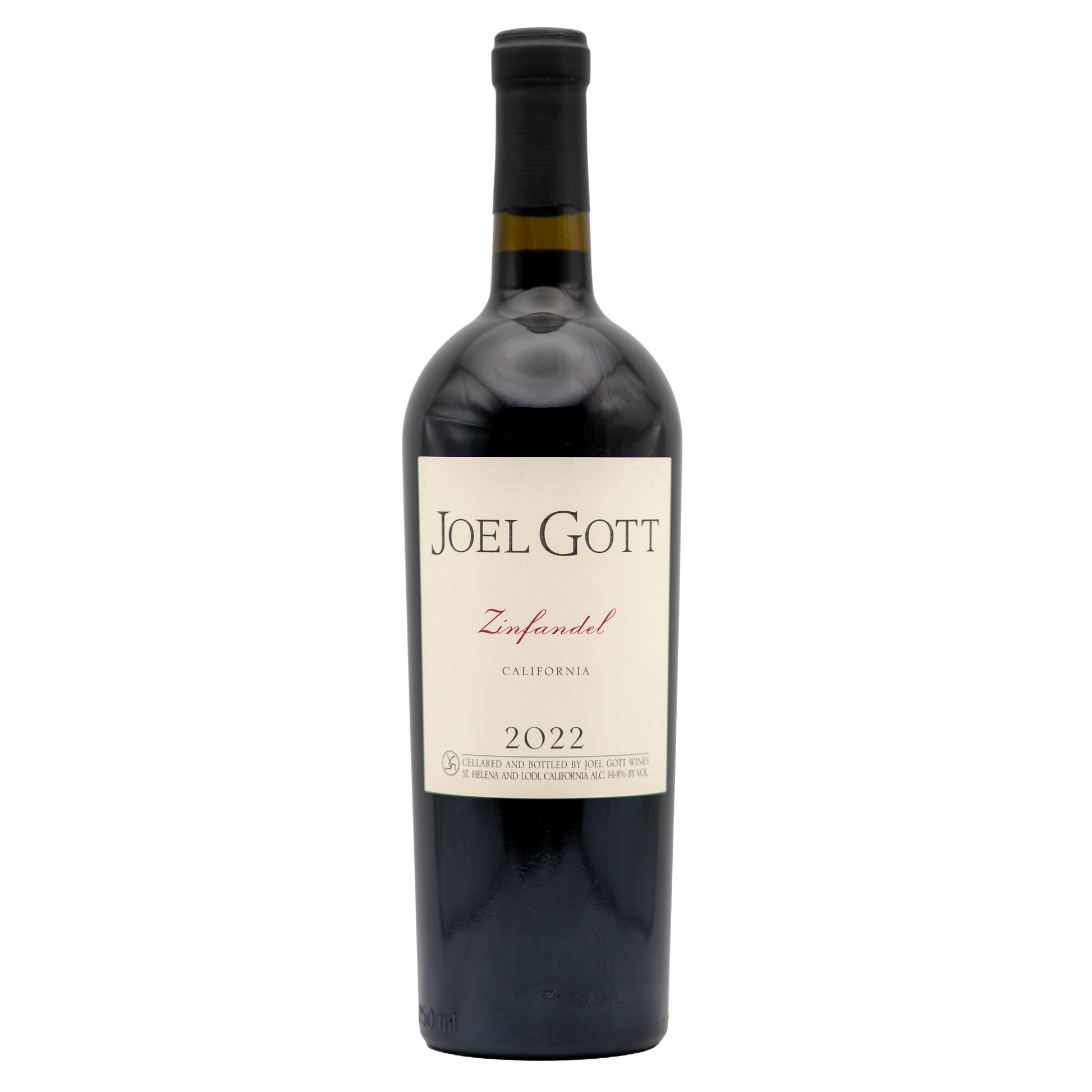 Bottle of Joel Gott Zinfandel red wine from Berkman Cellars with label and cork on a dark surface.